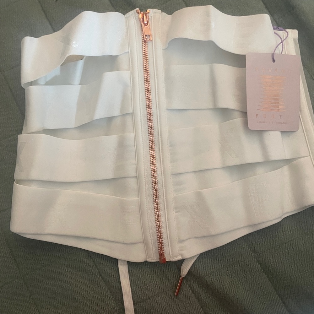 Savage, white corset